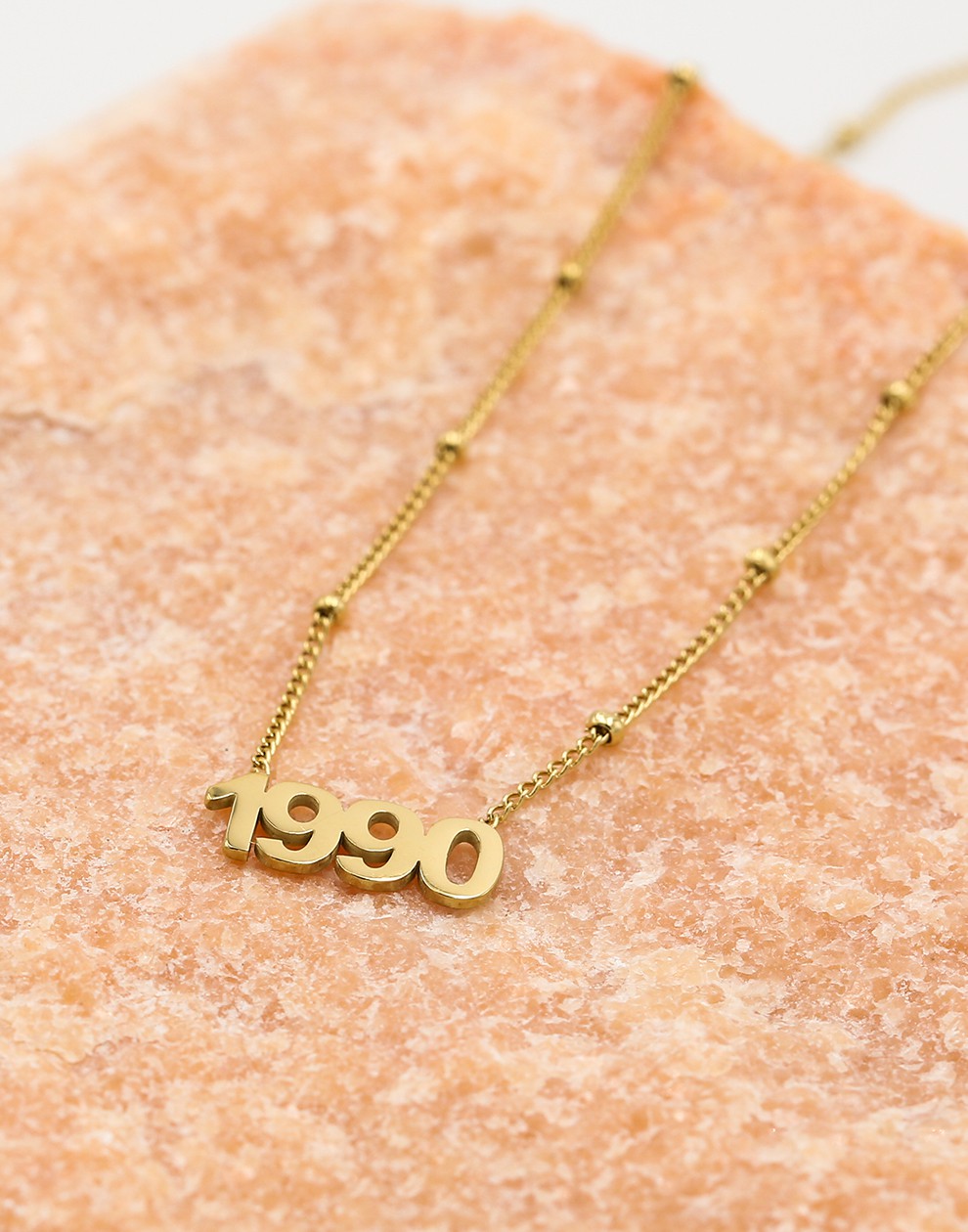 Ketting jaartal 1990 goudkleurig