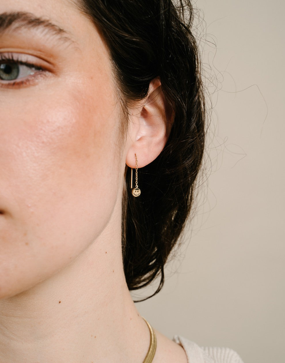 Gold-colored smiley earrings