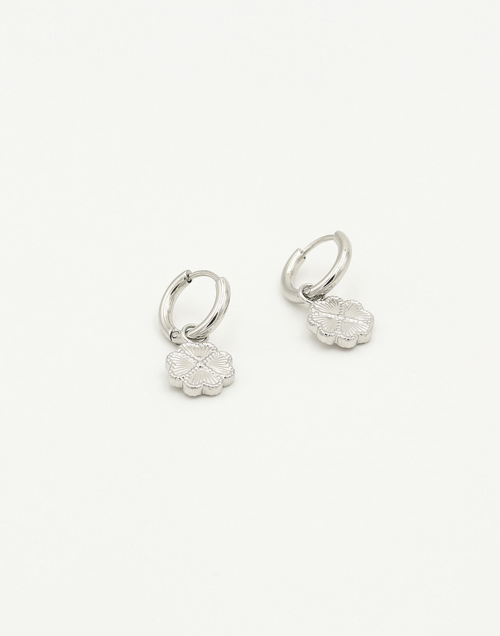 silver-colored clover love earrings