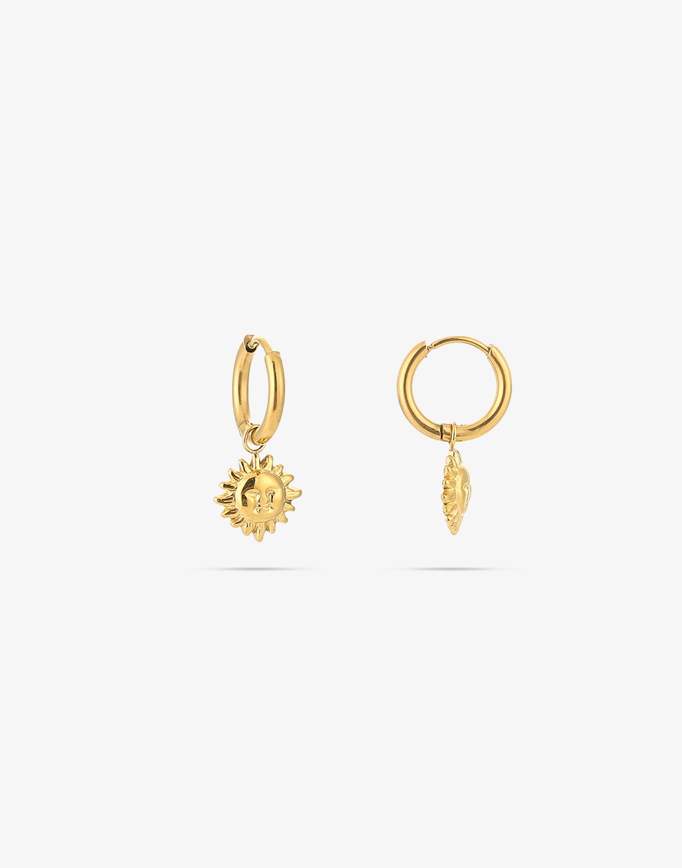 gold-colored sun earrings