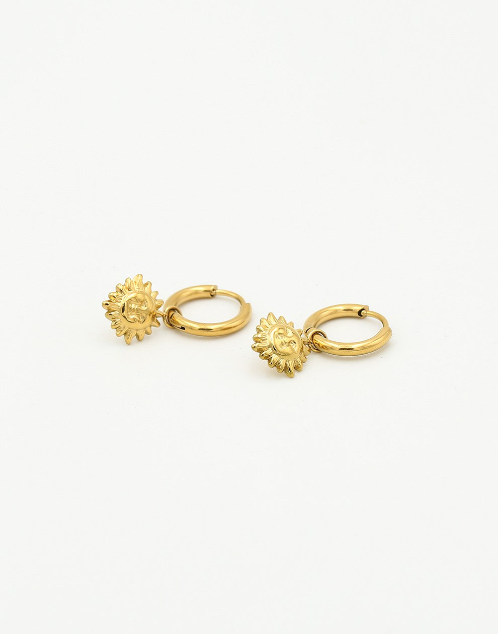 gold-colored sun earrings