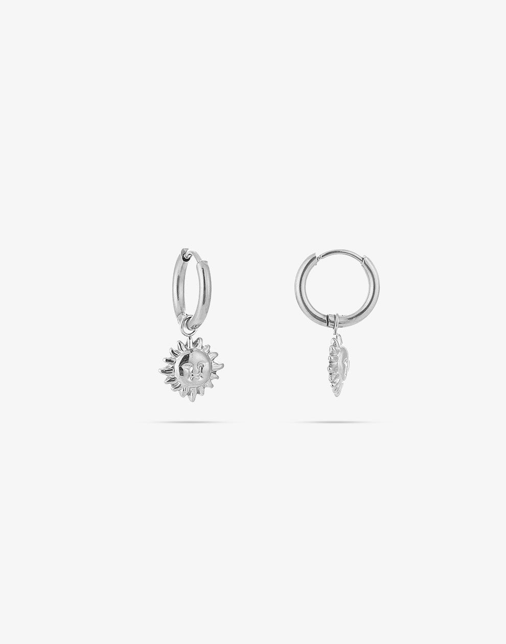 silver-colored sun earrings