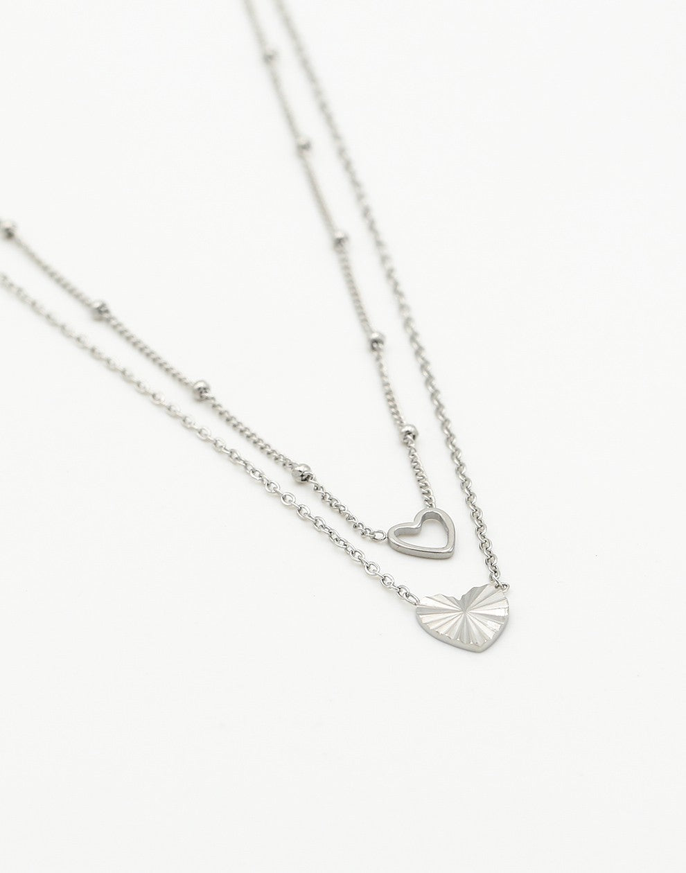 necklace two silver-colored hearts