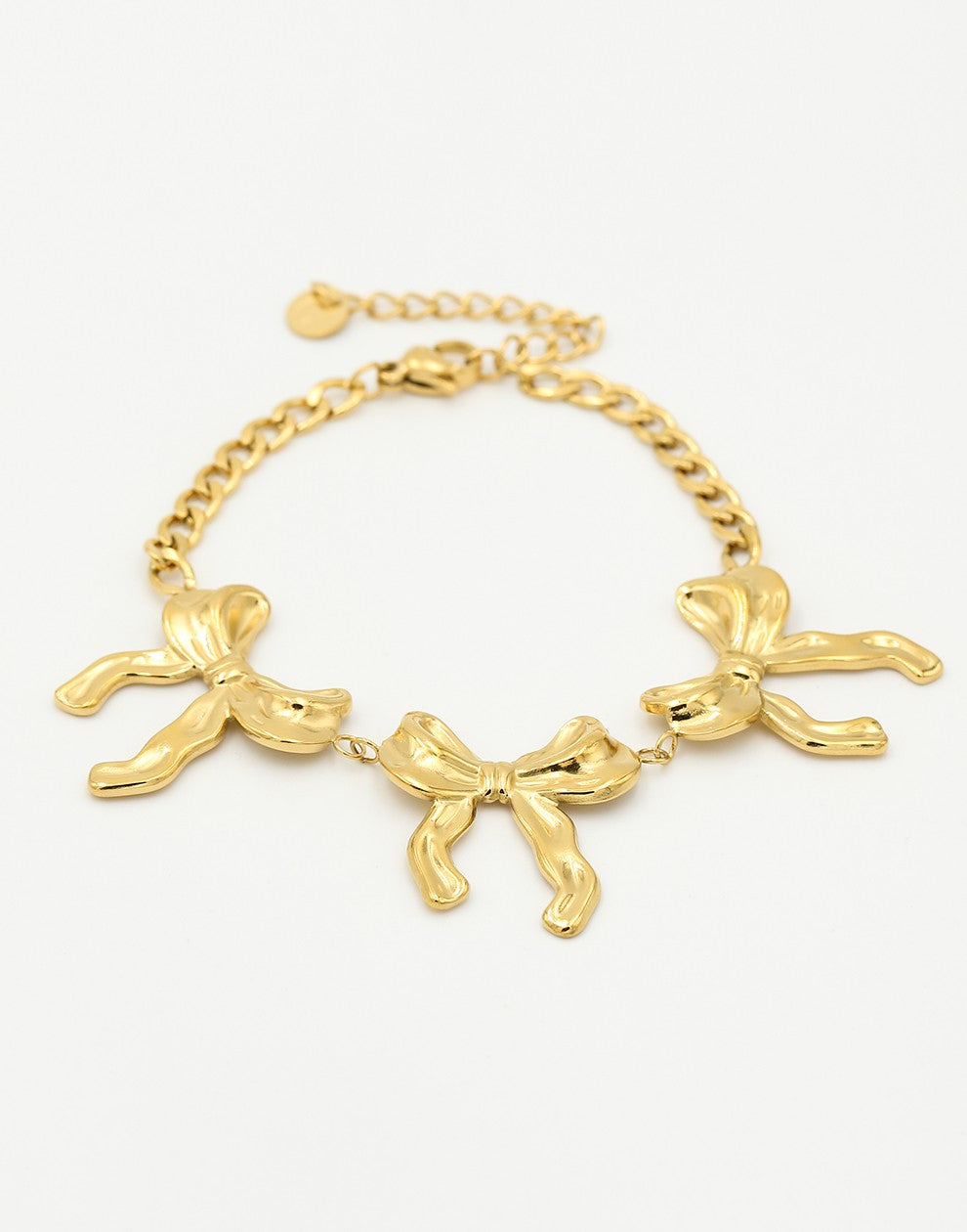 schakelarmband met 3 chunky strikjes goudkleurig