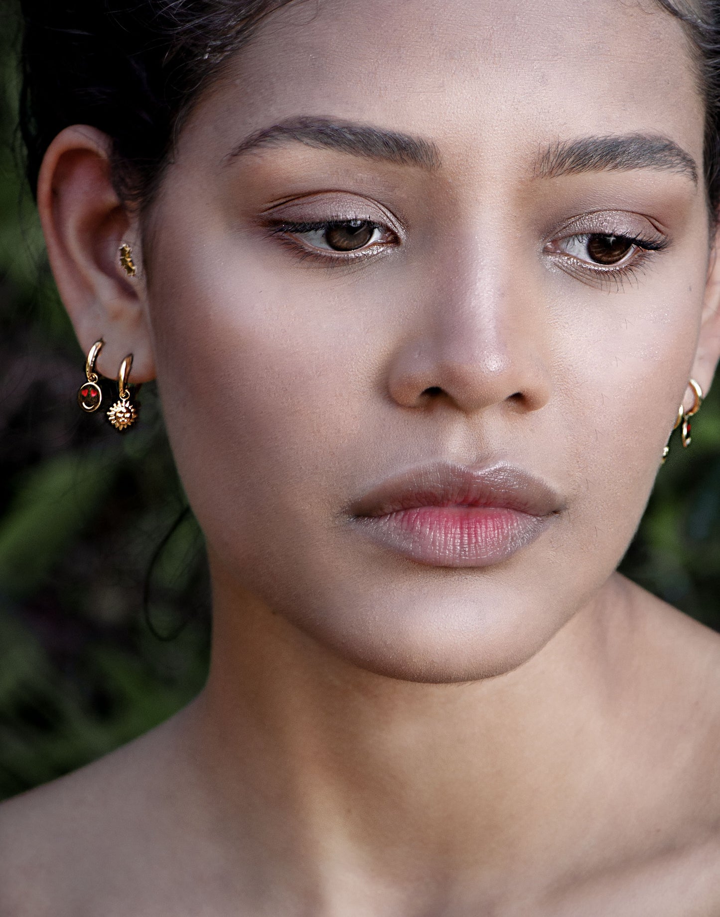 gold-colored sun earrings