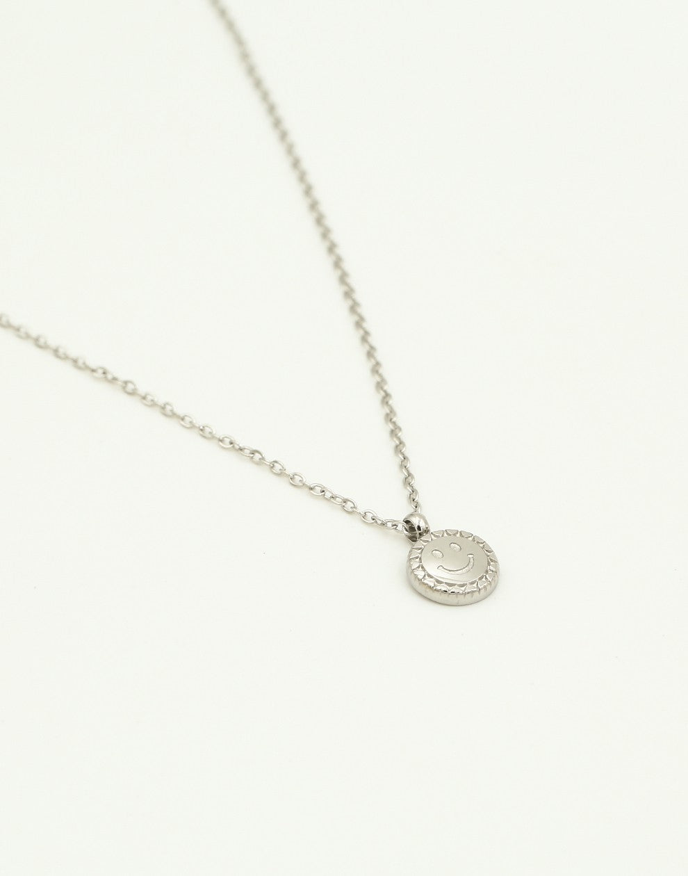 Ketting munt met smiley zilverkleurig