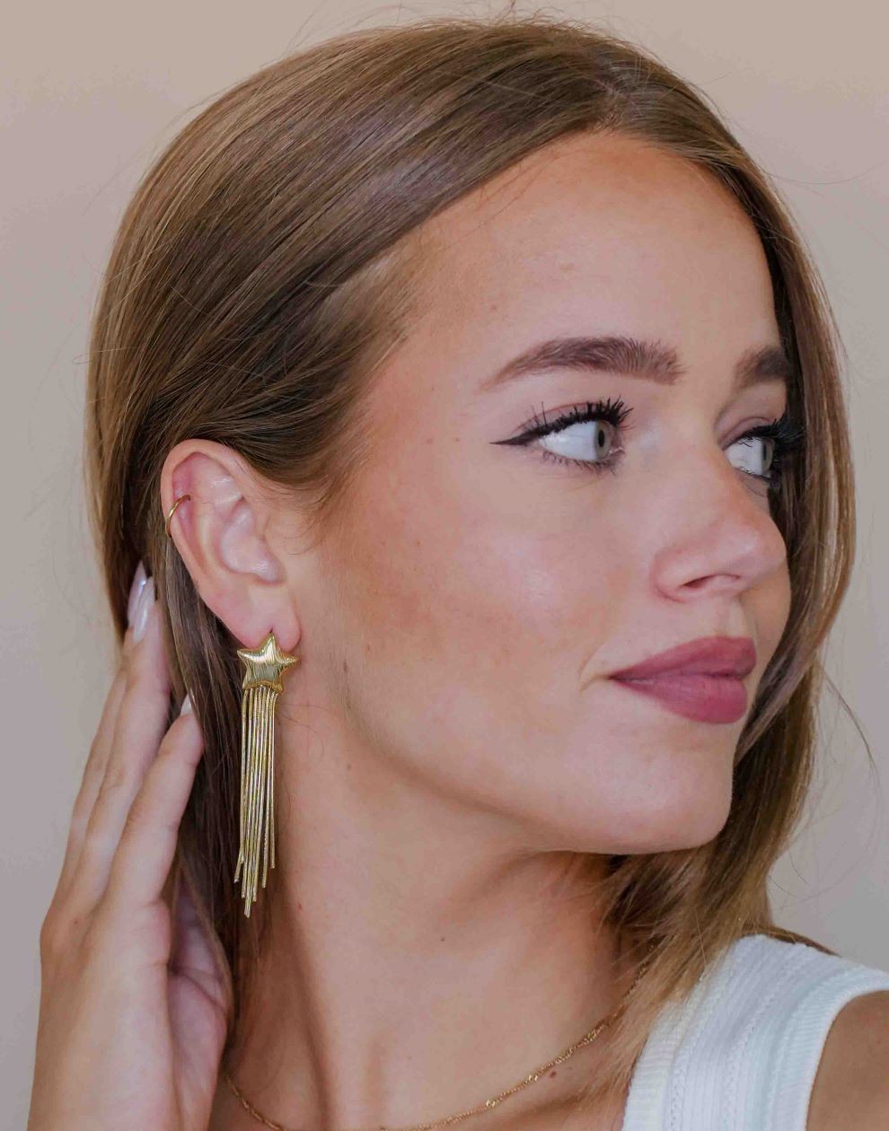 gold-colored star earrings party