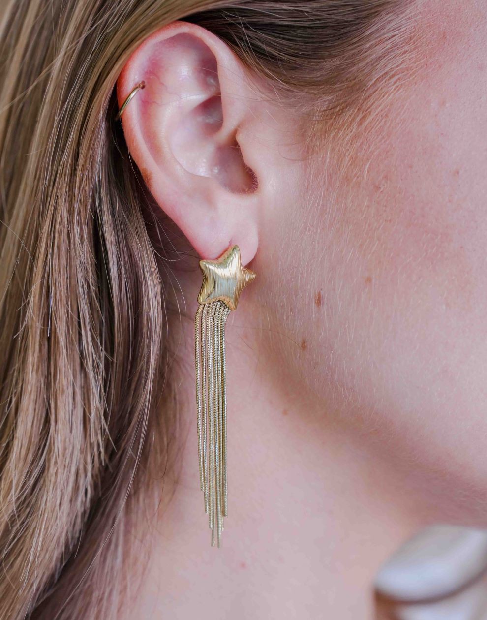 gold-colored star earrings party