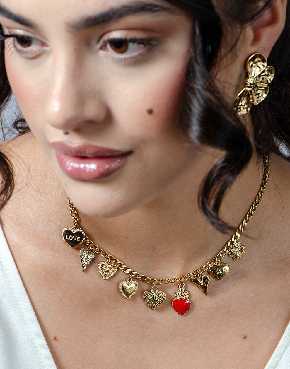 Bedelketting multi hartjes goudkleurig