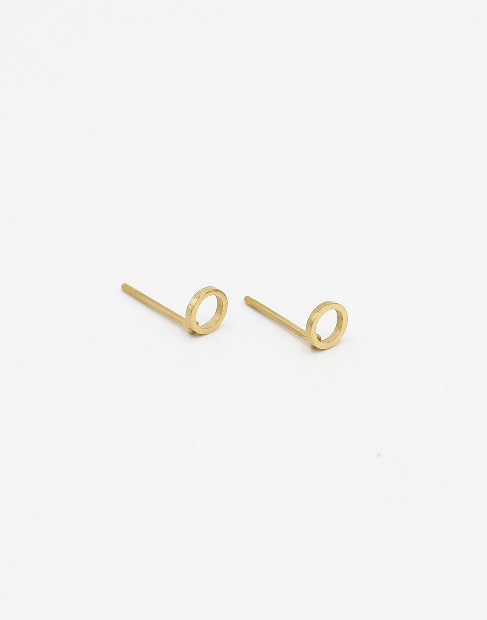 Open circle gold-colored earring