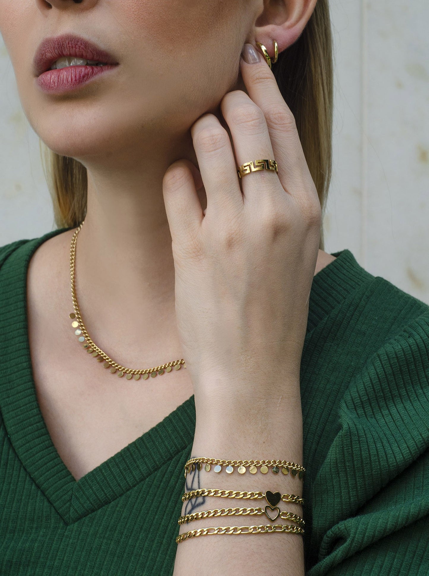 schakelarmband met fijne muntjes goudkleurig