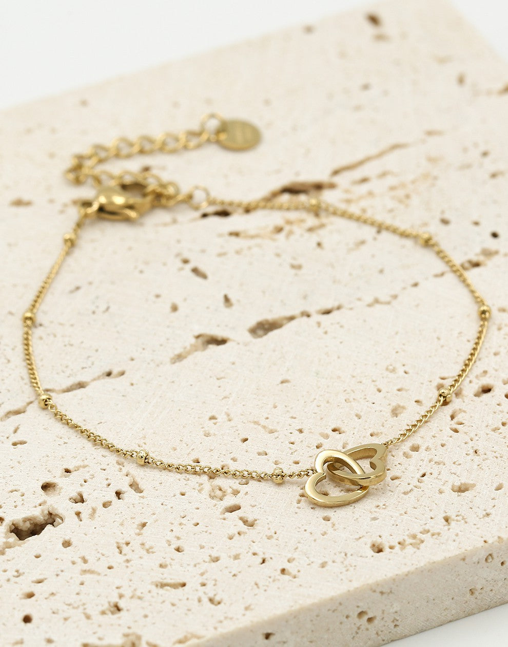 Armband met dubbele hartjes goudkleurig