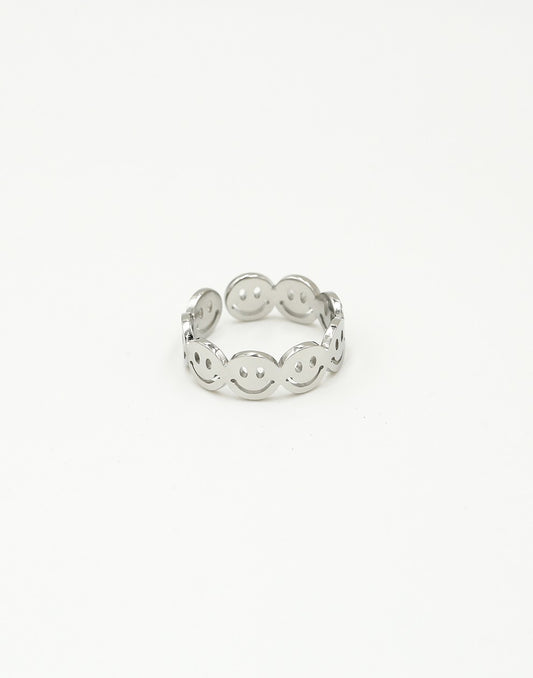 Silver-colored smiley ring