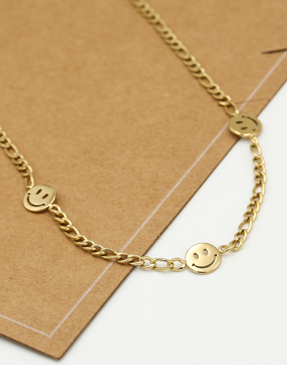 Schakelketting smileys goudkleurig