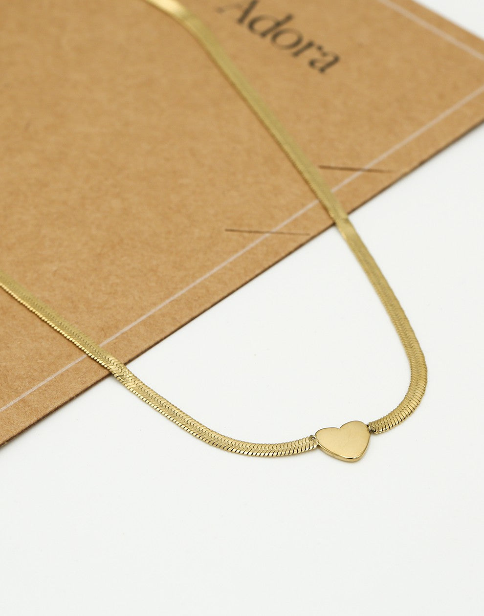 Flat chain with gold-colored heart