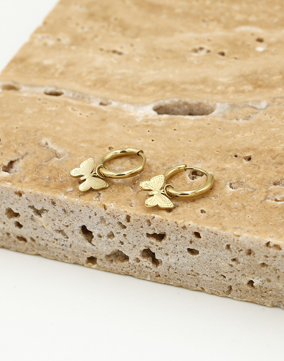 Gold-colored butterfly earrings
