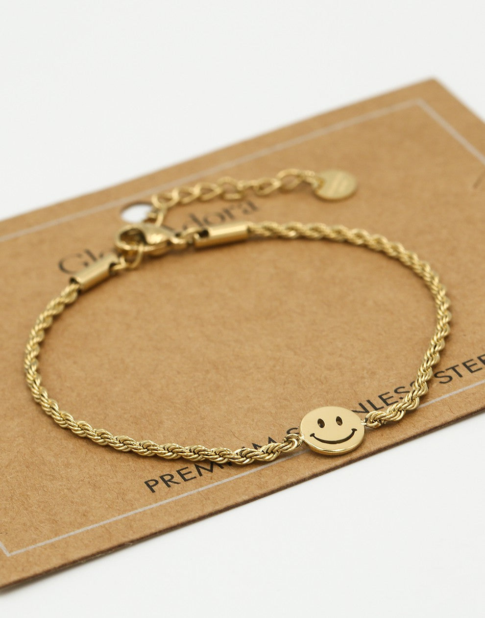 Gedraaide armband smiley goudkleurig