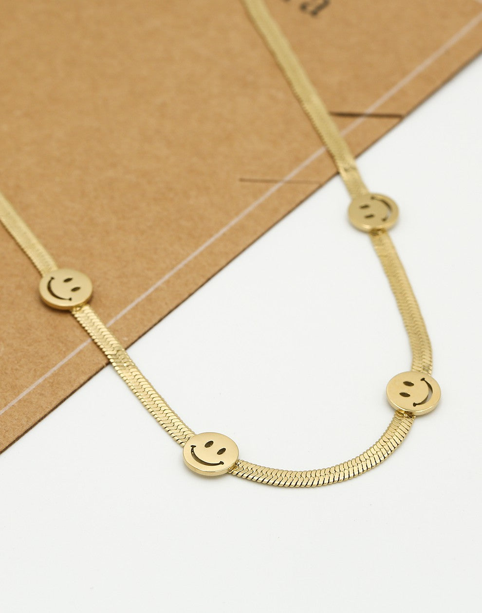 Ketting snake met smileys goudkleurig