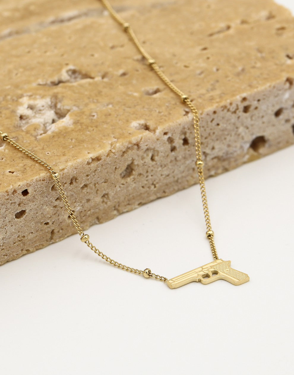 Balletjes ketting pistool goudkleurig