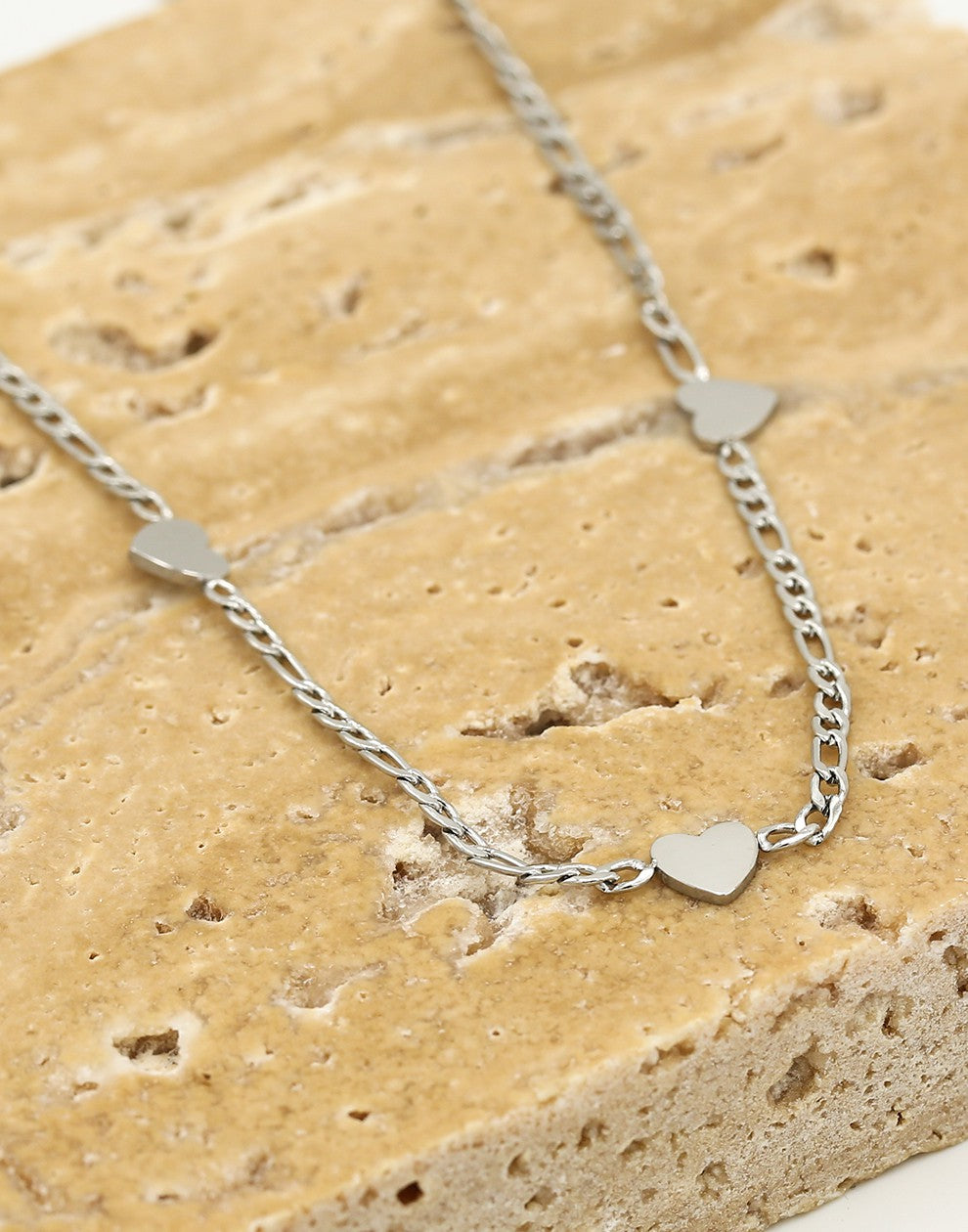 Schakelketting drie hartjes zilverkleurig