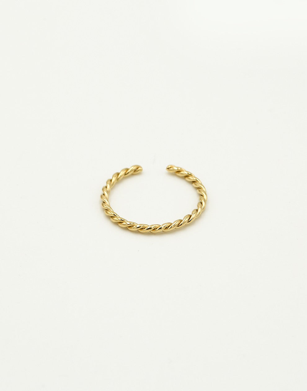Twisted gold-colored ring