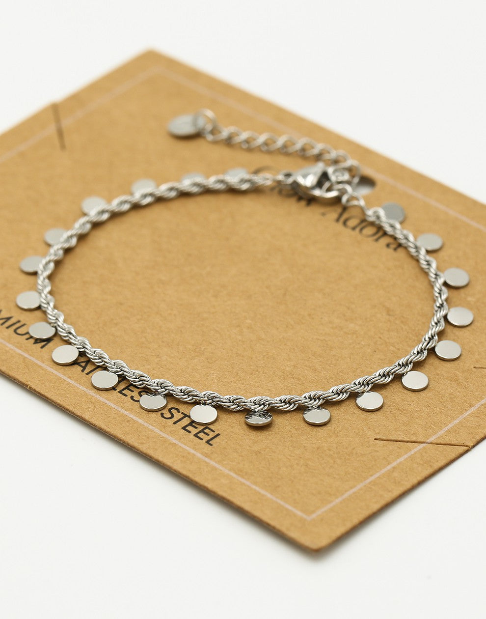Twisted bracelet with silver-colored coins