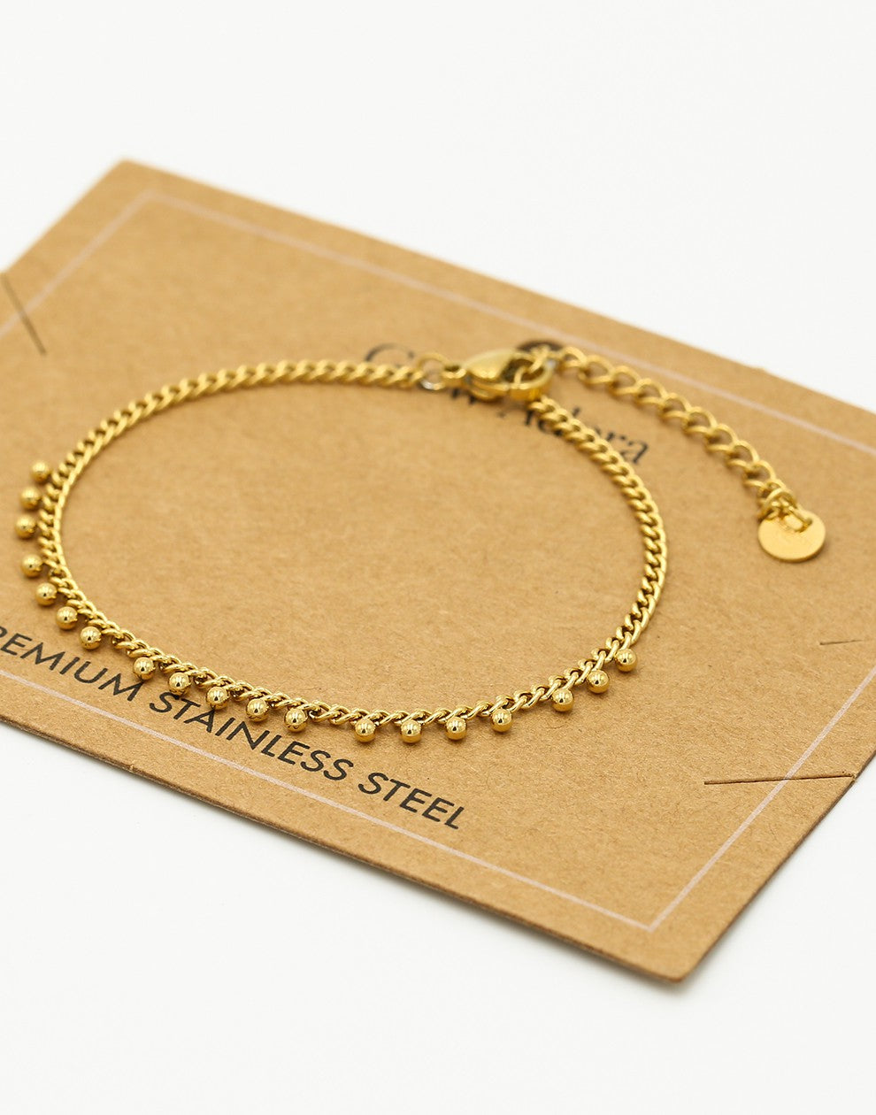 Schakelarmband bolletjes goudkleurig