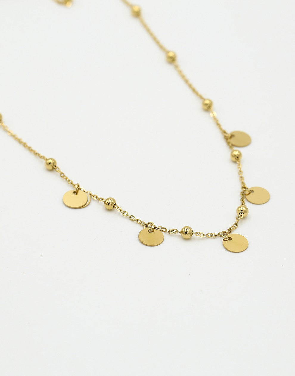 Bolletjes ketting met muntjes goudkleurig