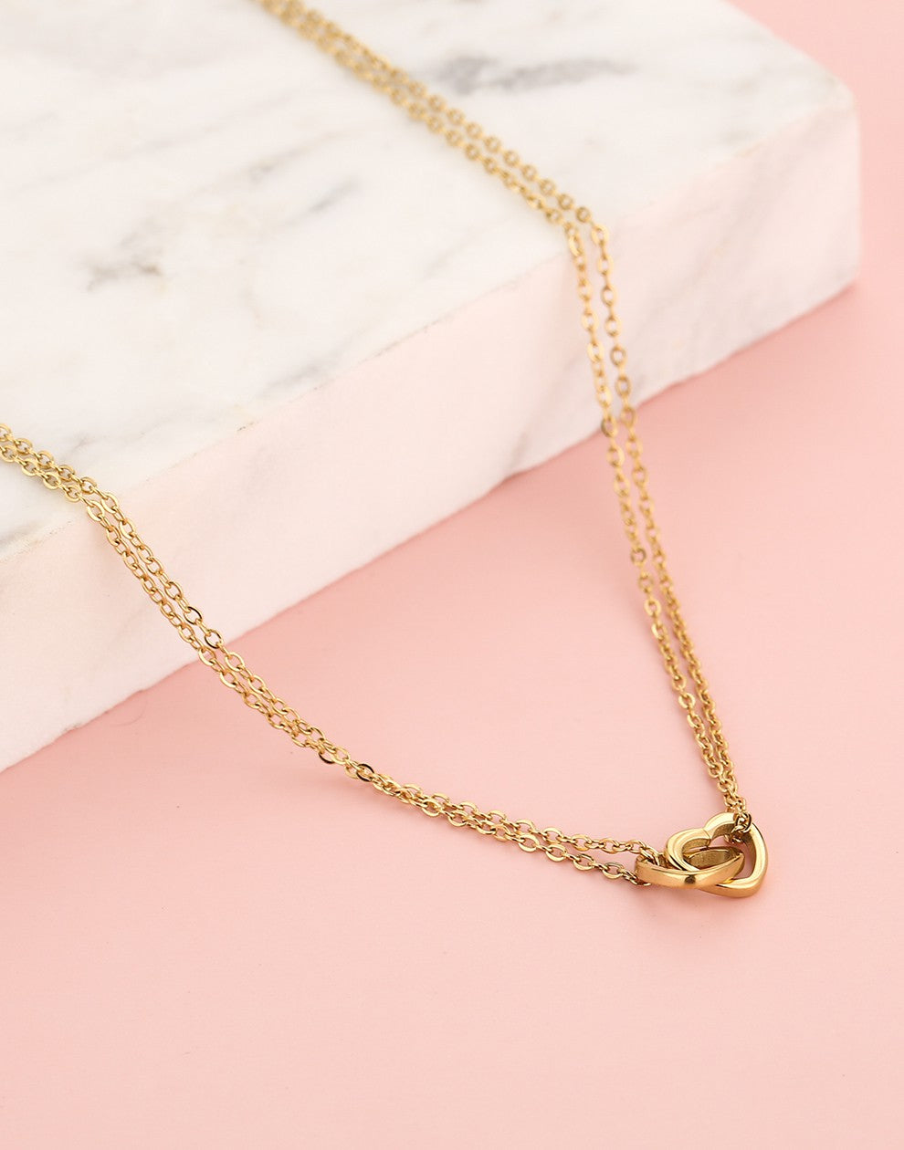 Fijne ketting dubbele hartjes goudkleurig