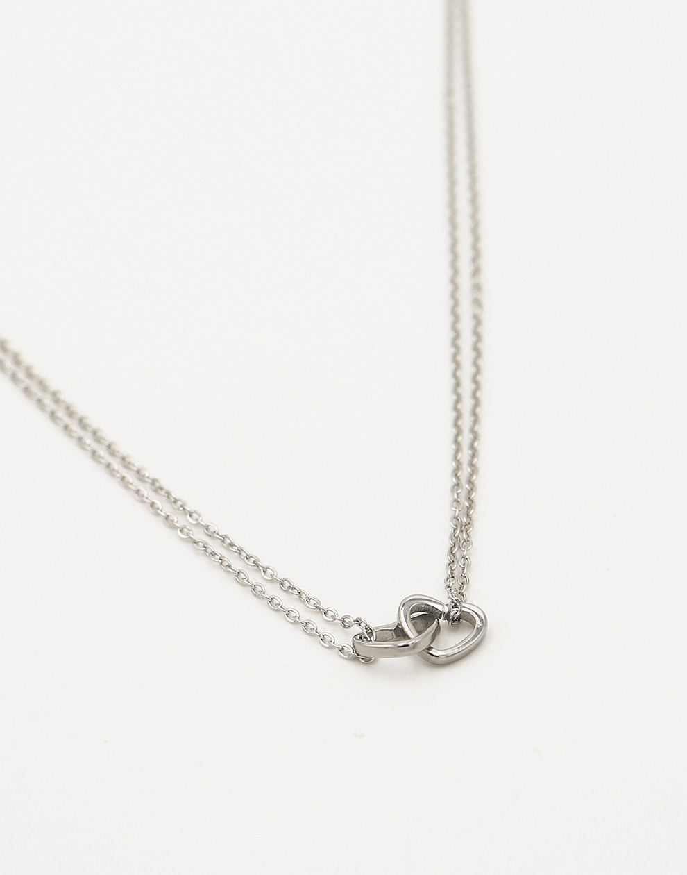 Fine necklace with double silver-colored hearts