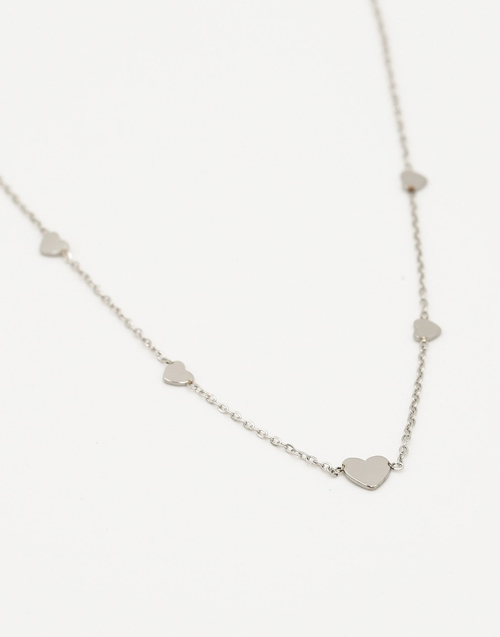 silver-colored heart necklace