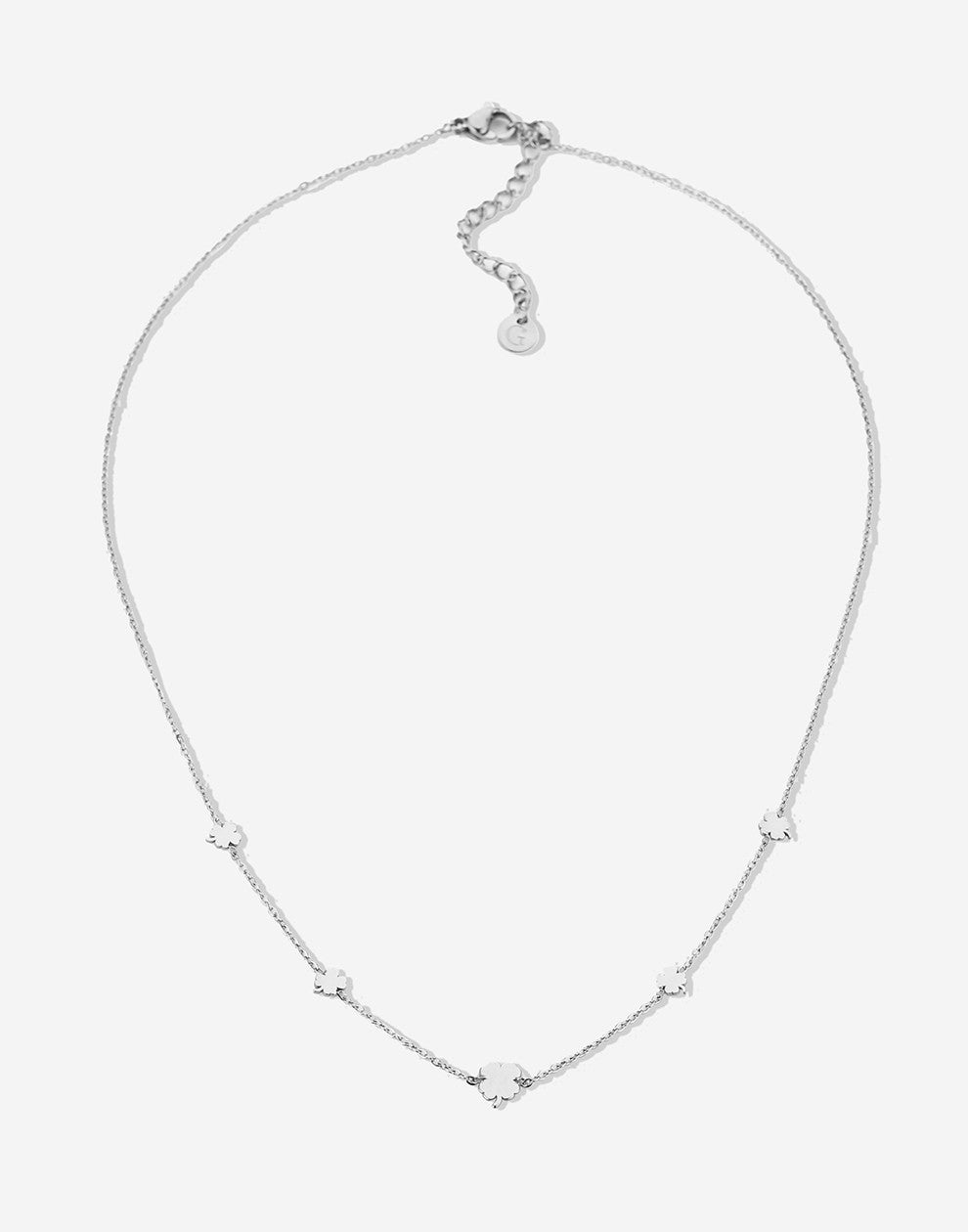 silver-colored clover necklace