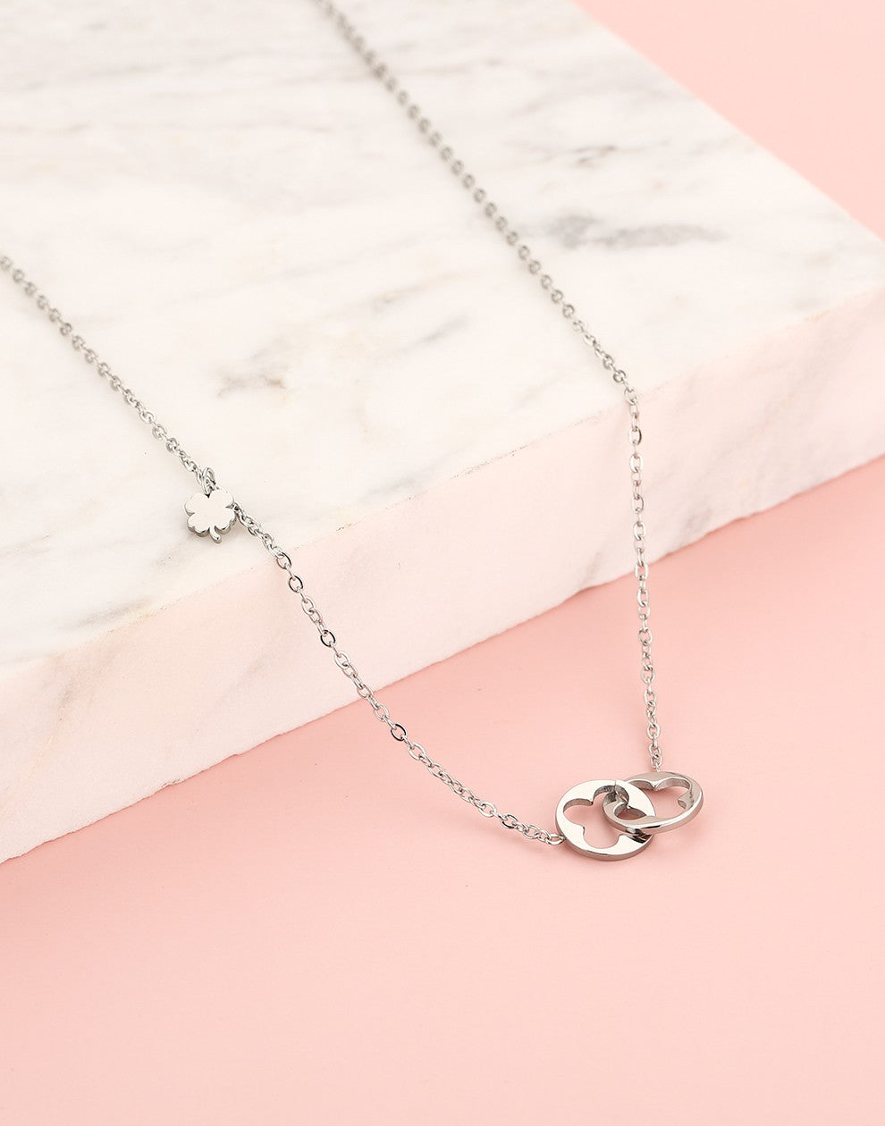 Necklace with double clovers connected in silver color
