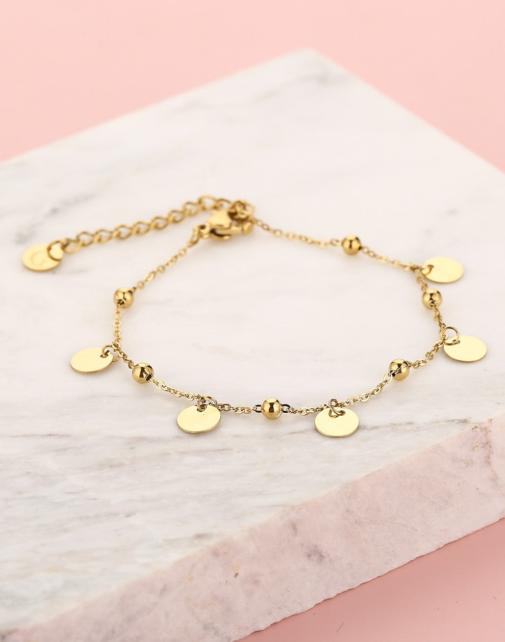 Bead bracelet with gold-colored coins