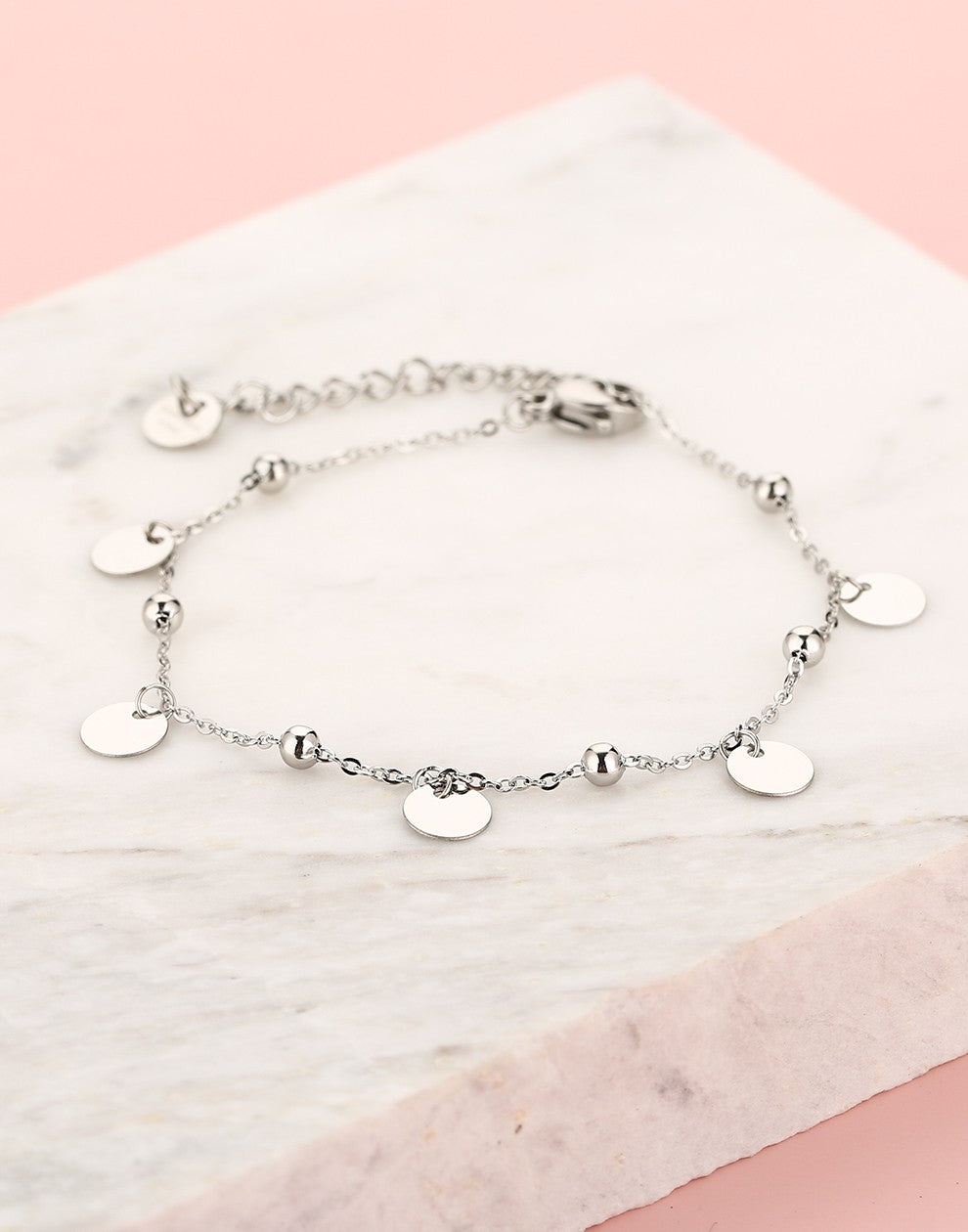 Silver-colored beaded bracelet with coins