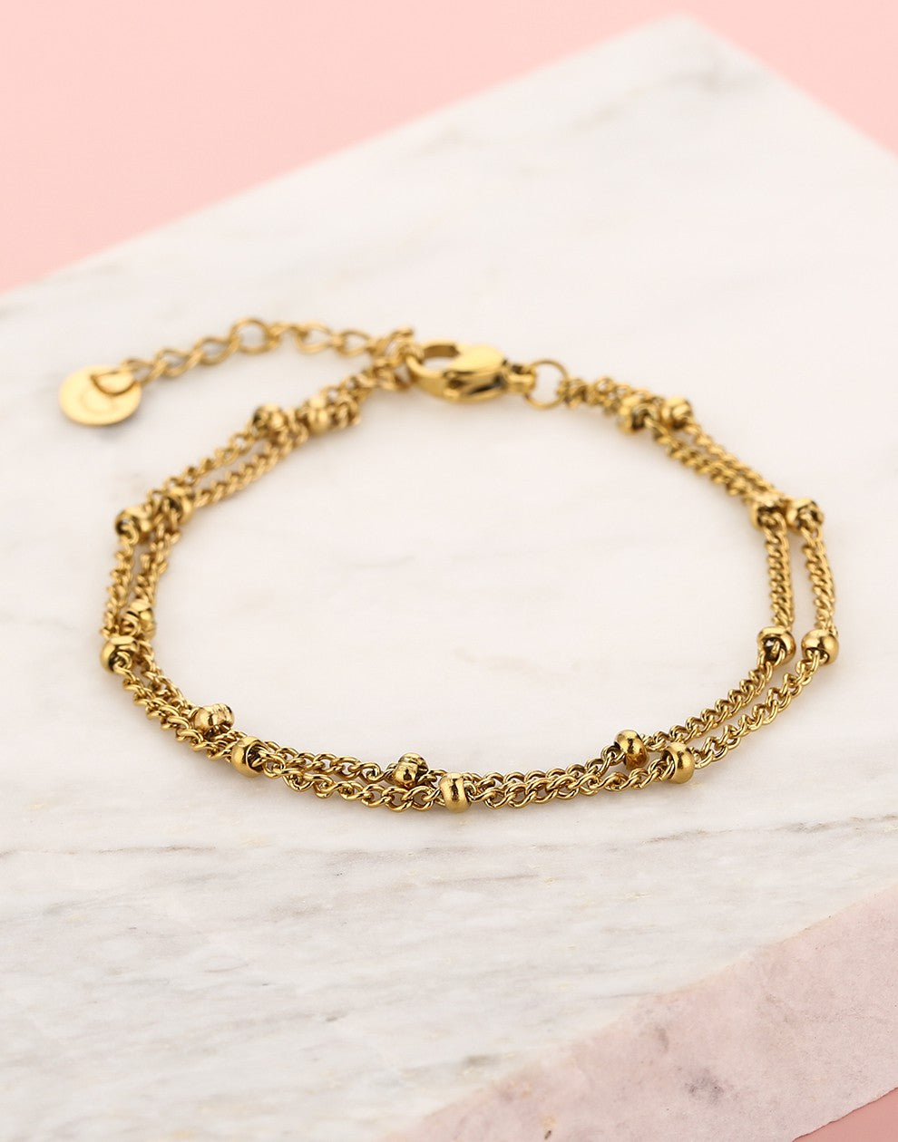 Bracelet with double gold-colored beads