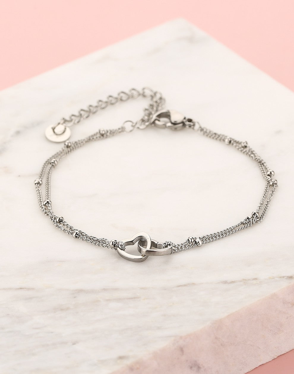 armband verbonden hartjes zilverkleurig