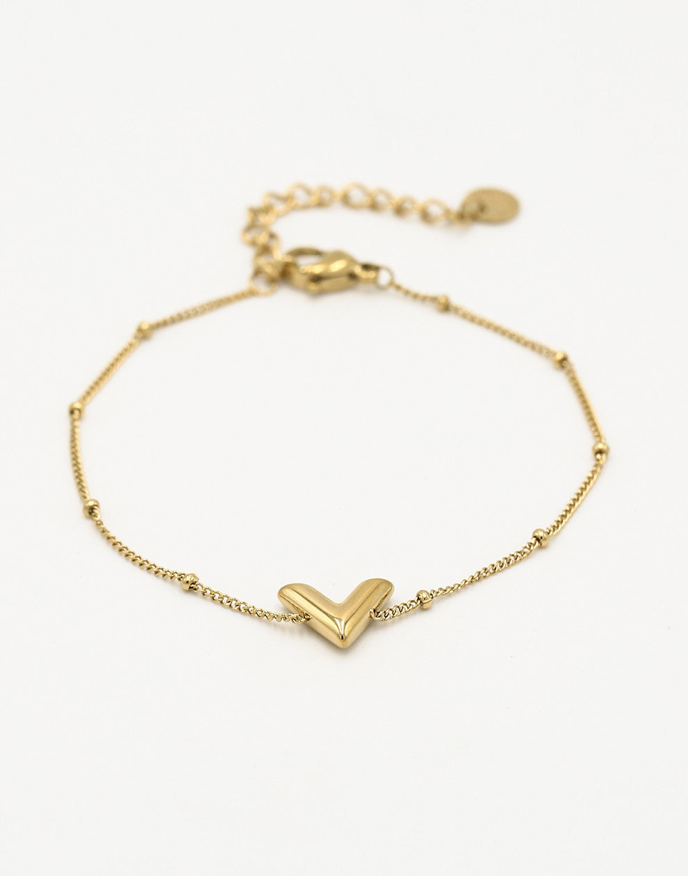 Armband V bolletjes goudkleurig