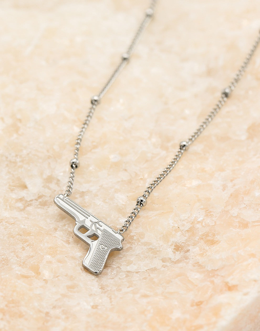 Balletjes ketting pistool zilverkleurig