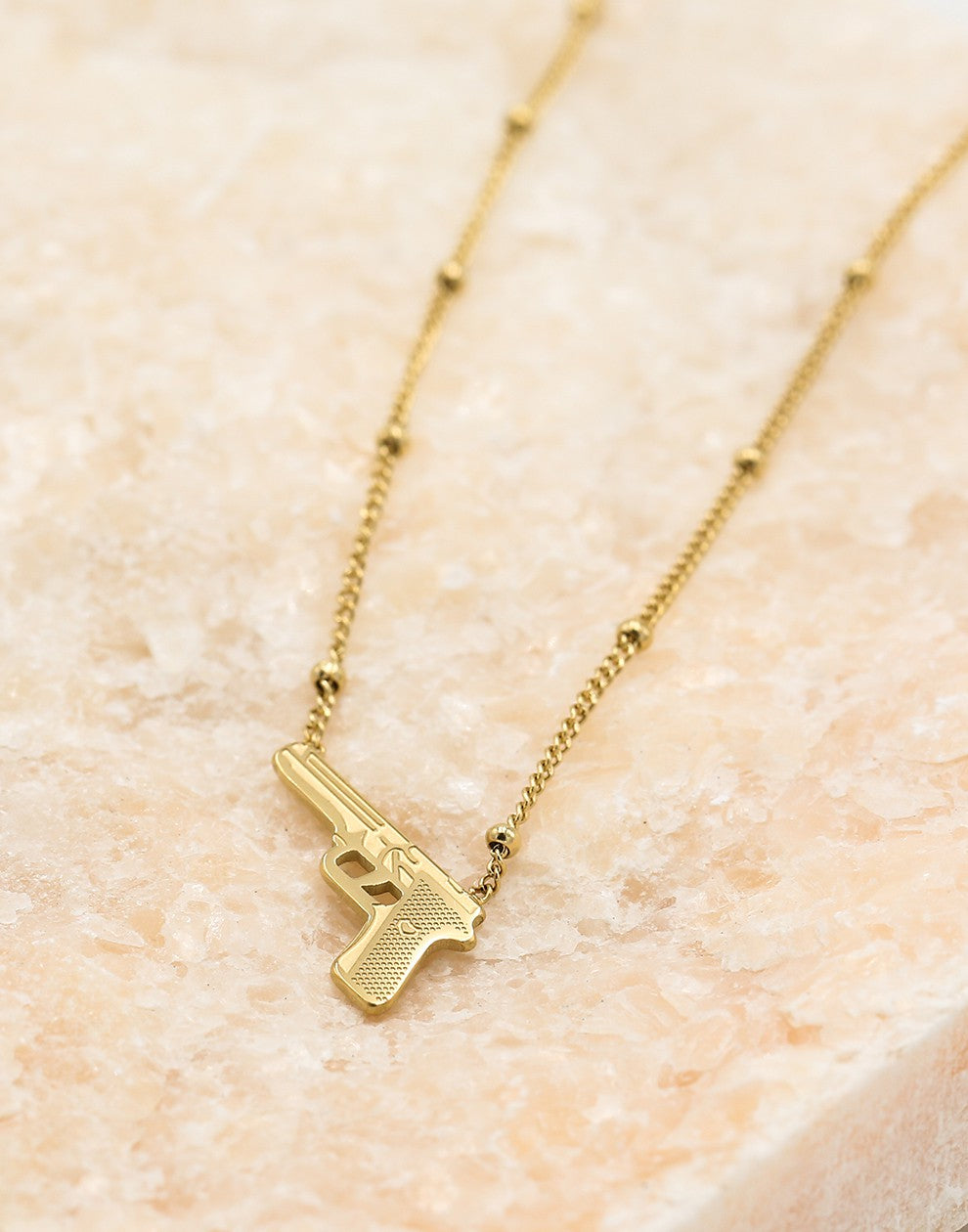 Balletjes ketting pistool goudkleurig