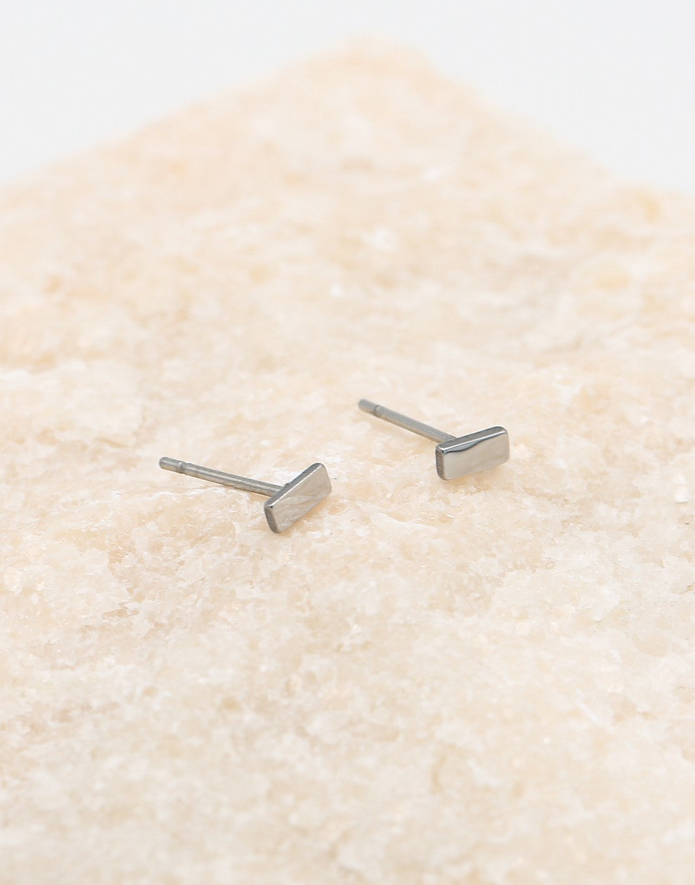 Silver-colored stud bar