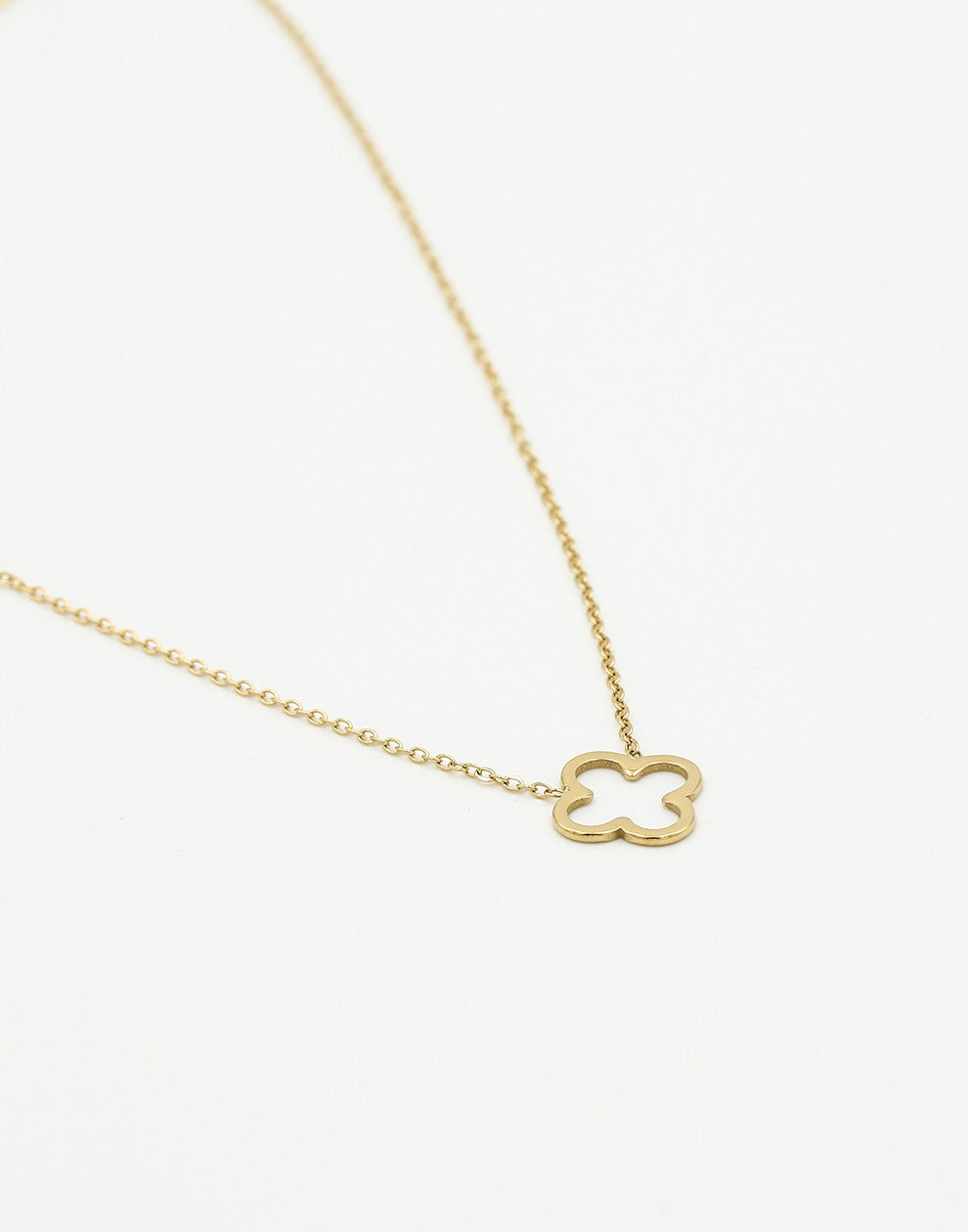 Gold-colored open clover necklace