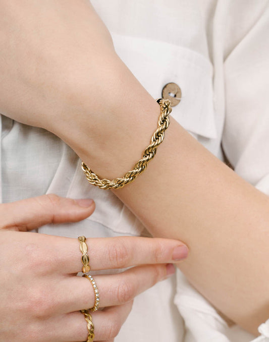 Schakelarmband gedraaid chunky goudkleurig