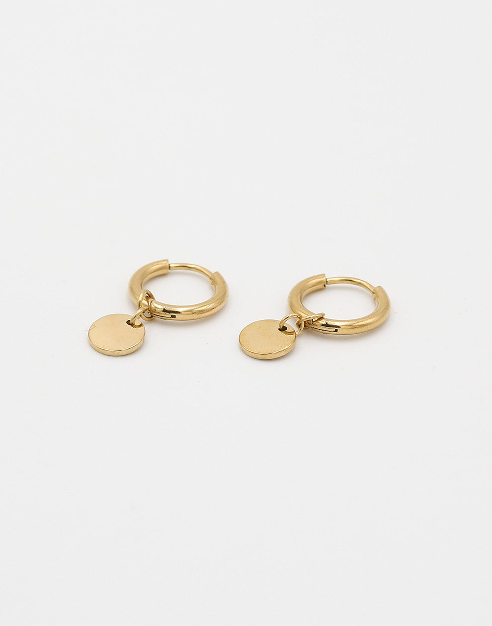 gold-colored coin earrings