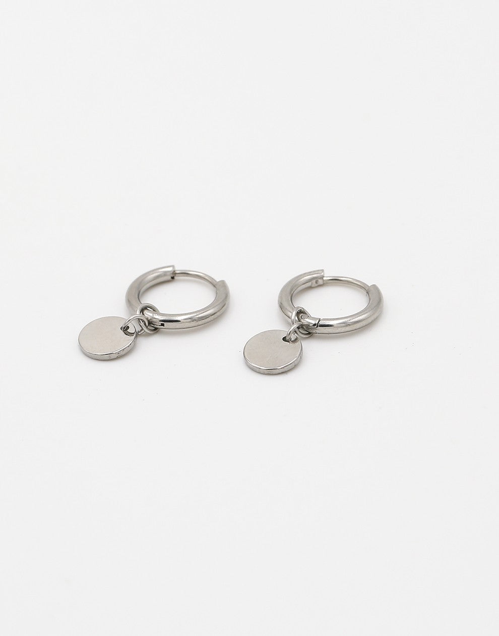 silver-colored coin earrings