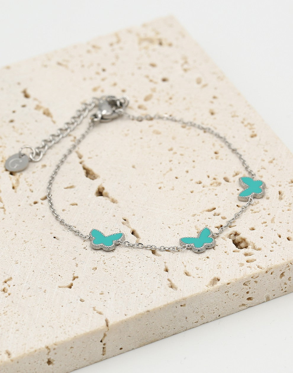 Armband vlinders turquoise zilverkleurig
