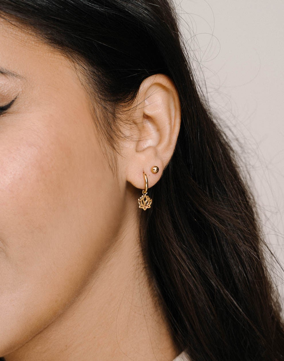 Gold-colored lotus flower earrings