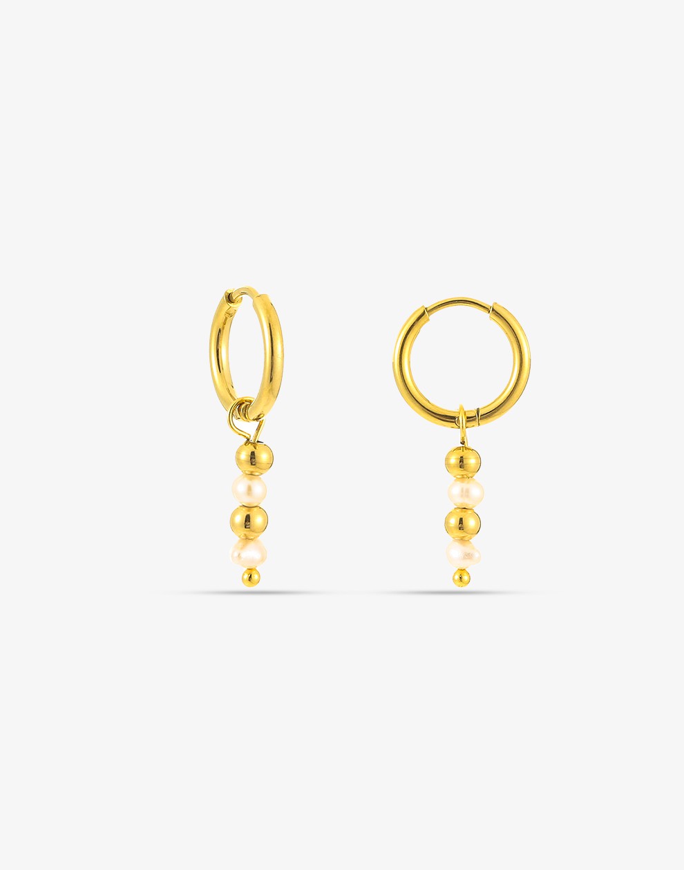 gold-colored ball and pearl earrings