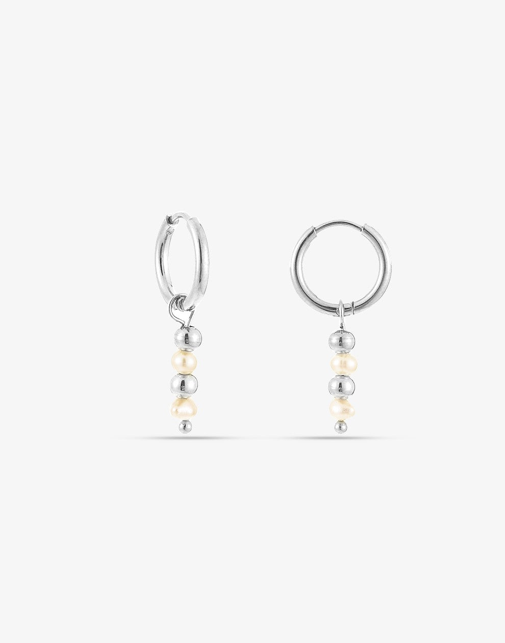 silver-colored ball and pearl earrings