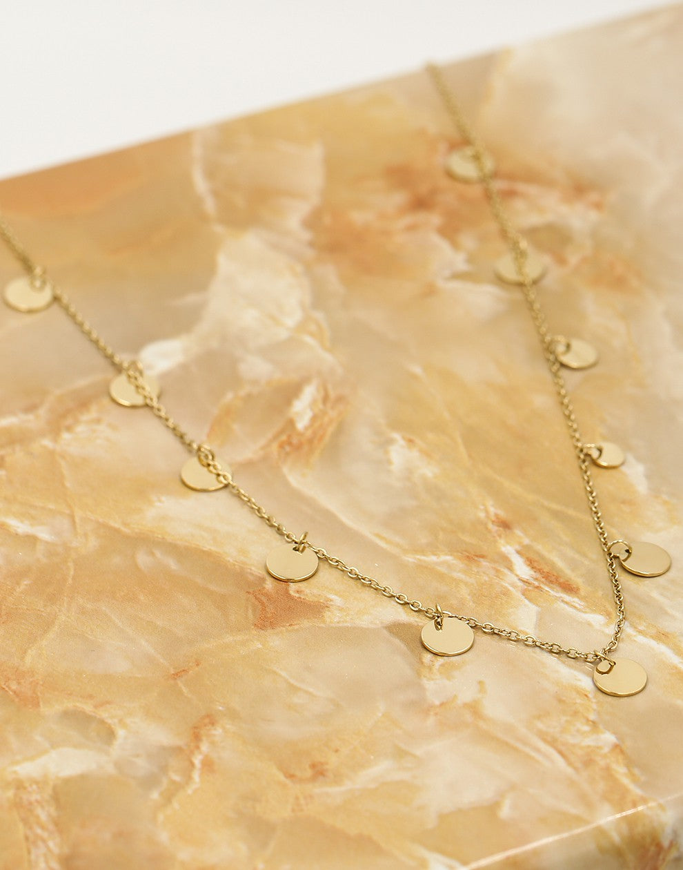 Fijne ketting met muntjes 7mm in goudkleurig